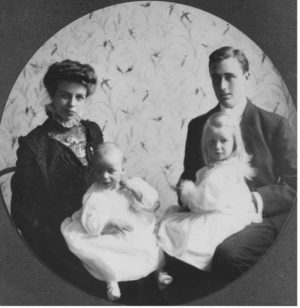 A seated portrait of Franklin and Eleanor Roosevelt with young Ana and baby James