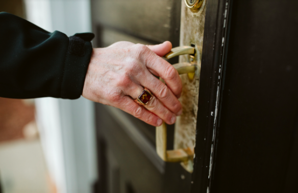 Freemason wearing Masonic ring and opening door Freemason wearing Masonic ring and opening door